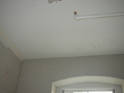 A room with some holes in the ceiling