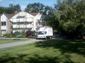 A white truck parked in front of a house.