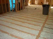 A room with some type of insulation on the floor