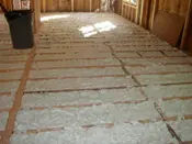 A room with many floors and walls covered in insulation.