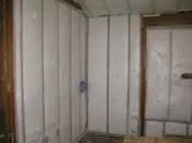 A room with walls and insulation in it