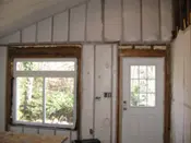 A room with some windows and doors in it