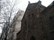 A brick building with trees in the background