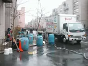 A truck is parked on the side of the road.