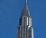 A tall building with an ornate design on it's side.