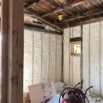 A room with insulation on the ceiling and walls.