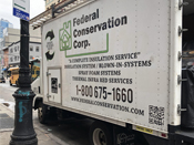 A white truck with the federal conservation corp. Logo on it's side